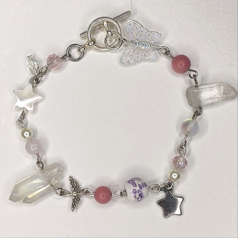 Bracelet with pink,crystal and star beads and a toggle clasp. Handmade by me.